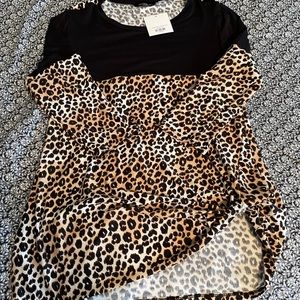 Buttery soft cheetah print top with twist at hip